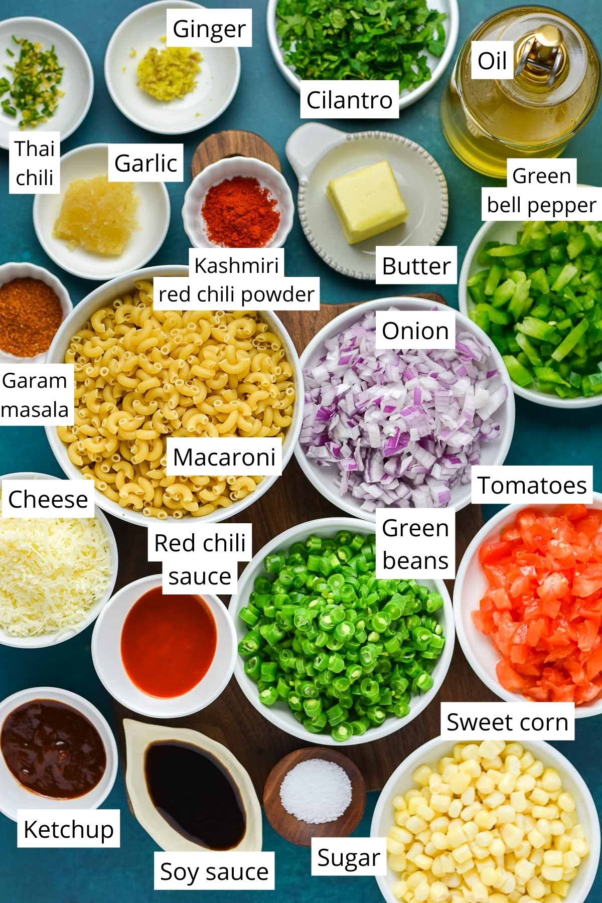 All the ingredients for masala macaroni measured and laid out in little bowls